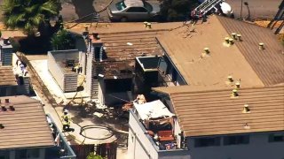 Firefighters at the scene of an apartment fire in San Jose.