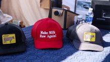 FRONT ROYAL, VA - OCTOBER 11, 2024: A vendor sells "Make Milk Raw Again" hats at the Homesteaders of America Conference held at the Warren County Fairgrounds in Front Royal, Virginia on October 11, 2024. (Photo by Valerie Plesch for The Washington Post via Getty Images)